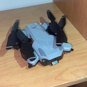 Gray drone with a remote control